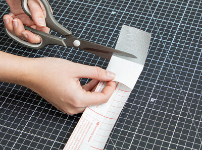 Use scissors to cut off the backing paper of the Glitter silver foil.